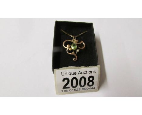An art nouveau gold and peridot pendant, total approximate weight 3.3 grams.