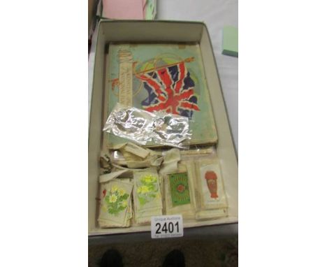 An album of Kensitas National Flags silk cigarette cards and a quantity of silks including ceramic art, flowers etc.,