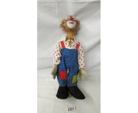 A rare early 20th century clown doll (possibly Steiff), in good condition for age, 40 cm tall.