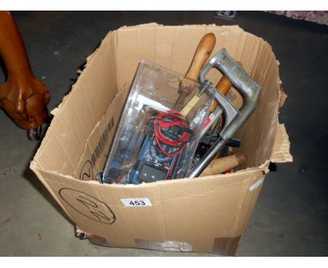 A collection of tools including plane, set squares, measuring instruments and multimeter