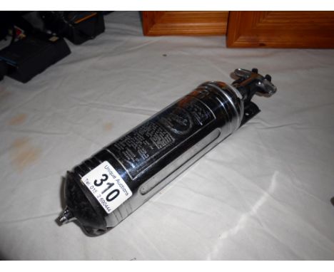 A vintage junior pyrene vehicle fire extinguisher with original mounting bracket