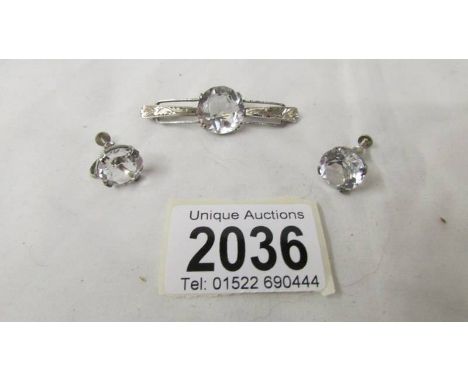 A vintage quality white paste brooch and screw back earrings (match lots 2034 and 2035).