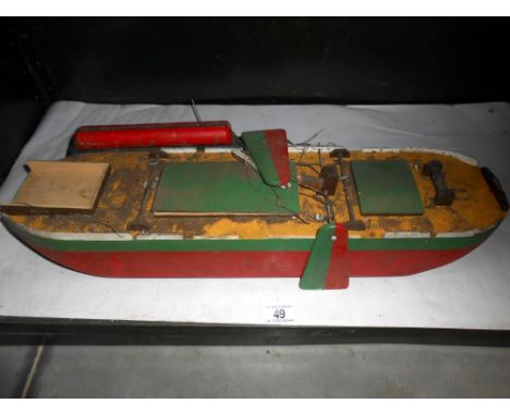 A vintage wooden model of a boat a/f length 59cm