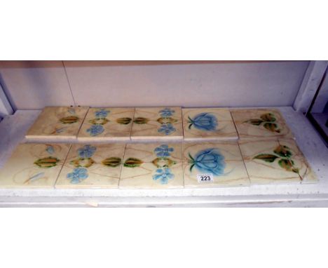 A set of art nouveau decorated fire place tiles a/f (3 glued back together)