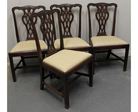 SET OF FOUR MAHOGANY CHIPPENDALE STYLE DINING CHAIRS, having interlaced, scrolled backs under foliate moulded, crestings with