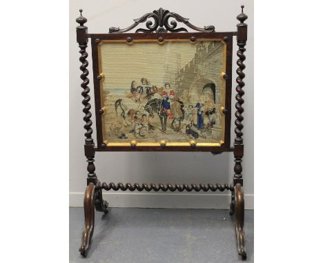 VICTORIAN ROSEWOOD FIRE SCREEN, having scrolled cresting above rectangular Berlin woolwork banner on spirally turned upright 