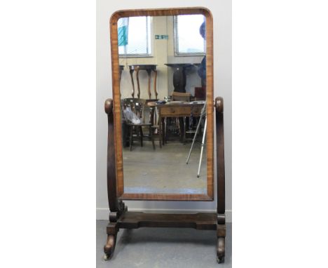 VICTORIAN MAHOGANY CHEVAL MIRROR, having rectangular plate, scrolled horns and on a base of four outswept scroll feet with ce