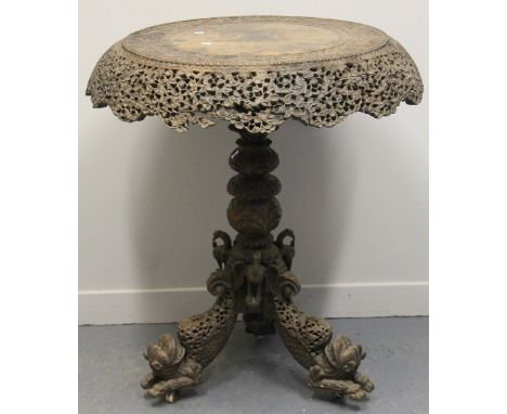 19TH CENTURY INDO-BURMESE CARVED HARDWOOD CIRCULAR PEDESTAL TABLE, overall copiously carved and pierced with flower heads and