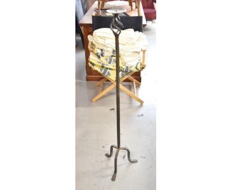 A wrought iron pricket candlestick. H.116cm