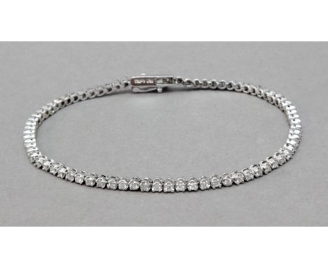 Pulsera tipo riviere . Montura en oro blanco de 18 k. y diamantes talla brillante. Cierre de caja con ocho de seguridad. 8,18