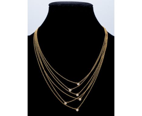Gargantilla de seis vueltas. En oro amarillo de 18 k. con seis diamantes talla brillante de 0,10 ct. aprox. engastados en cha