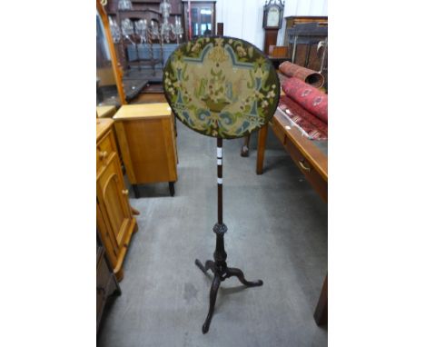 A Chippendale Revival carved mahogany pole screen 