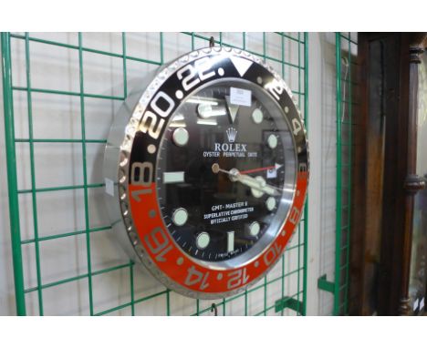 A Rolex style dealer's display circular wall clock 