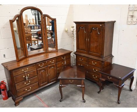 An American walnut dressing table with large triptych mirror, with drawers and panelled cupboards on ogee bracket feet, 172 c