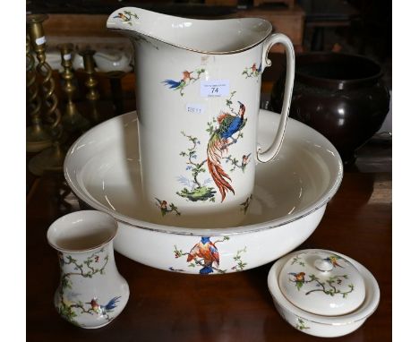 A pottery ewer and basin, printed with exotic birds to/w the matching soap-dish and toothbrush-jar (4)