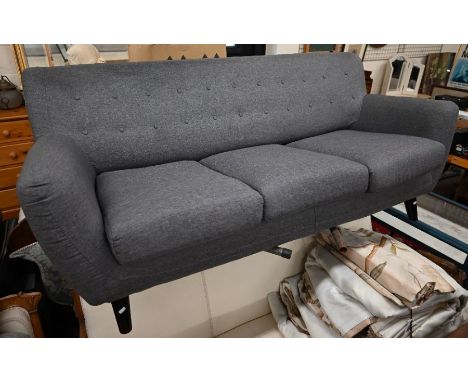 A contemporary three seater sofa charcoal grey button back upholstery on tapering turned legs, 185 cm wide x 75 cm deep x 85 