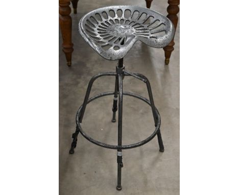 A cast iron tractor seat bar stool, pitted corrosion aged metal finish&nbsp;