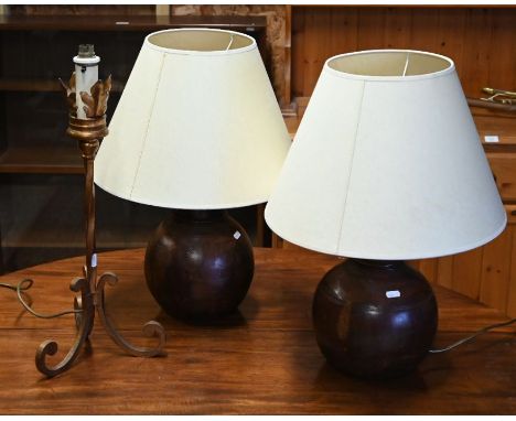 A pair of contemporary wooden ball form table lamps to/w another gilt metal lamp (3)