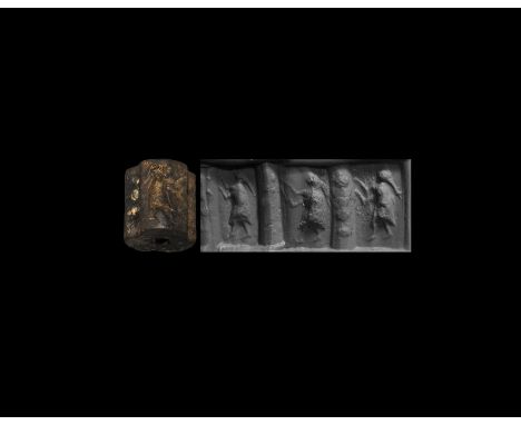 3rd millennium BC. A limestone cylinder seal divided in three sections, each with a standing woman; accompanied by a museum-q