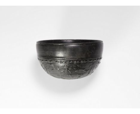 Late 3rd century BC. A fine and rare shallow bowl (????????) with low inturned rim, black glazing inside and outside; relief 