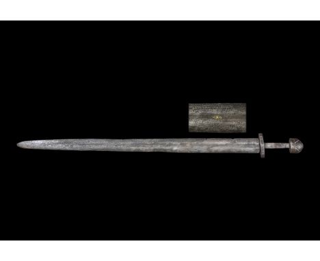 9th century AD. An iron double-edged sword of Petersen's Type 2 its tapering blade with battle nicks to the sides, long fulle