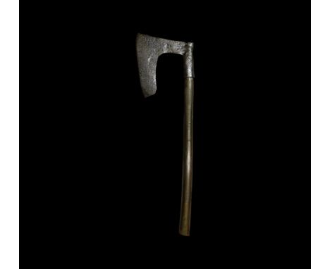 14th-15th century AD. An iron axe-head with long straight blade mounted from the upper edge, short wooden haft. 2.2 kg, 79cm 