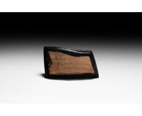 4th century AD. A ceramic rectangular ostracon, Greek demotic inscription reading: ???? (couple) / ??? (??) MODIOY (a modios 