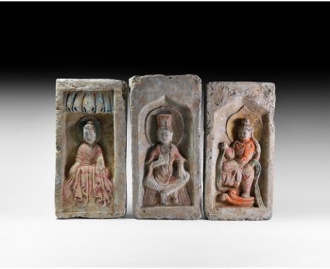 Northern Wei Dynasty, 386-534 AD. A group of three polychrome terracotta bricks comprising: one with a Buddha seated beneath 