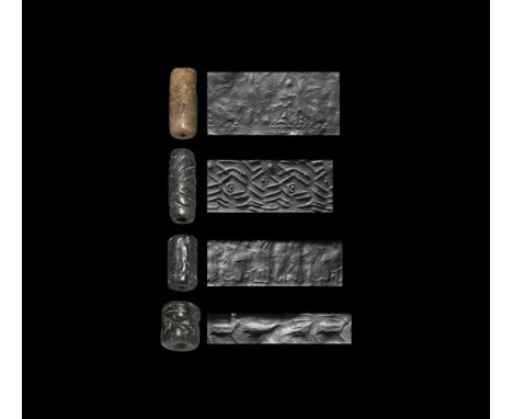 31st-8th century BC. A mixed group of cylinder seals, serpentine (1), limestone (3), drilled vertically for suspension; each 
