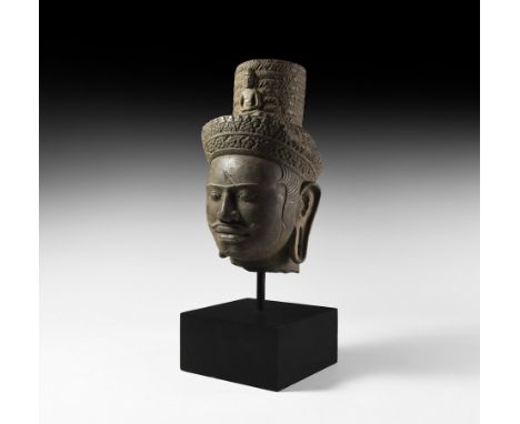 10th-12th century AD. A sandstone head of Avalokitesvara from a statue, with makuta crown of braided hair and miniature Buddh