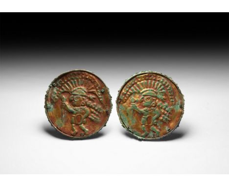 2nd-6th century AD. A pair of gilded copper-alloy ear spools, each with gold surface and red-brown cinnabar colouration; the 