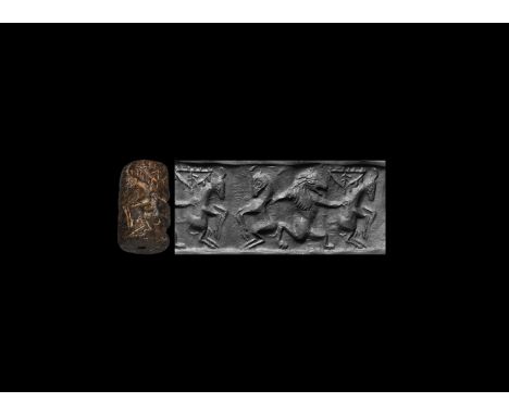 24th-20th century BC. A brown and black limestone cylinder seal, drilled vertically for suspension; accompanied by a museum-q