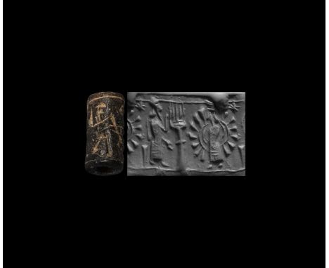 10th-8th century BC. A black limestone cylinder seal, drilled vertically for suspension; accompanied by a museum-quality impr