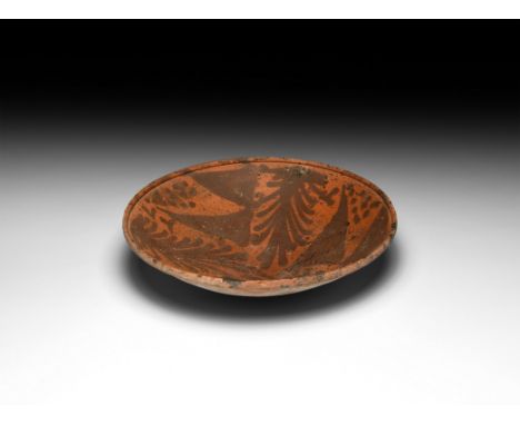 3rd-1st century BC. A ceramic conical bowl with raised rim, painted decoration of fronds, cones and pellets. 119 grams, 17cm 