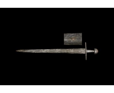 12th-13th century AD. An iron double-edged sword of Petersen Type X and Oakeshott Type Xa, its tapering blade with narrow ful