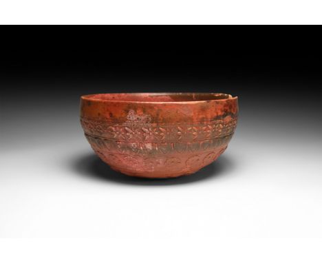 2nd century BC. A squat hemispherical Samian ware cup with rosette and acanthus-leaf motifs to the centre, bands of egg-and-d