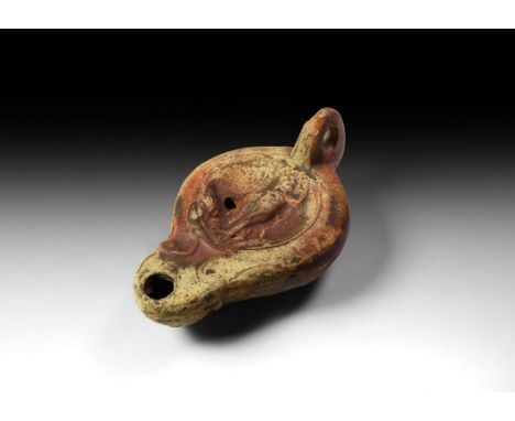 1st century AD. A terracotta lamp formed of two halves, made of brown clay covered with good quality glaze, each half made in