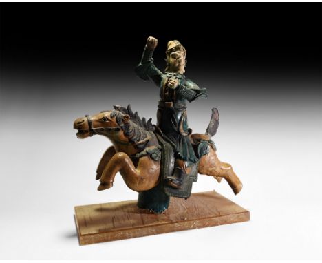 Ming Dynasty, 1368-1644 AD. A polychrome glazed ceramic roof finial formed as a galloping horseman with arms raised and hands