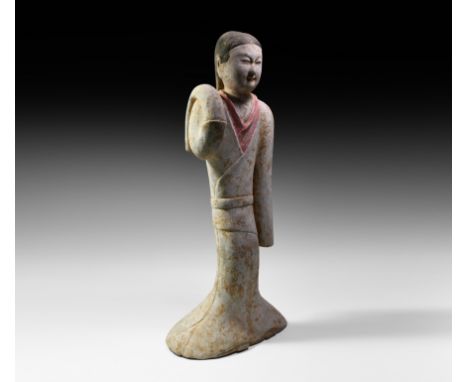 Han Dynasty, 206 BC-220 AD. A hollow-formed ceramic figure modelled as a female dancer wearing a floor-length robe, long slee