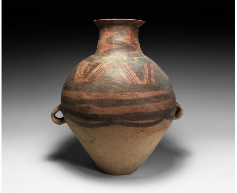 3rd millennium BC. A ceramic jar of piriform profile with broad neck and everted rim, two strap handles to the equator; the u