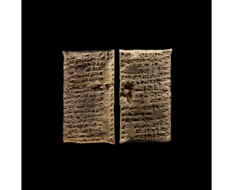 Dated August/September 1803 BC. A pillow-shaped clay tablet with cuneiform text concerning the division of a big tract of lan