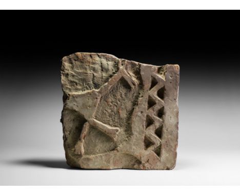 3rd-2nd millennium BC. A sub-rectangular ceramic tile fragment with a band of chevrons between two plain lines below the fron