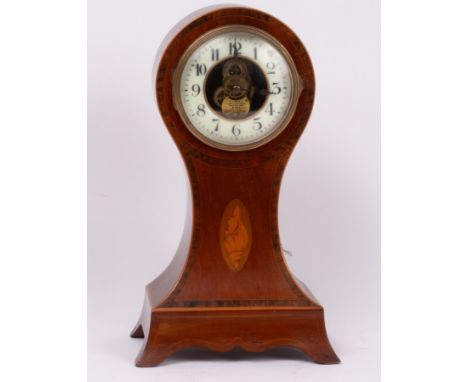 An Edwardian mahogany balloon-shaped mantle clock, cross banded and inlaid a satinwood shell, fitted an Eureka electric oscil
