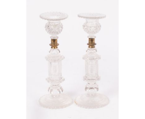 A pair of 19th Century heavy cut glass candlesticks, octagonal step-cut stems and petal feet, 28cm high CONDITION REPORT: Con