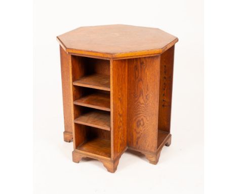 An oak free standing bookcase, early 20th Century, octagonal, with four sets of shelves on bracket feet, 67.5cm wide x 72cm h