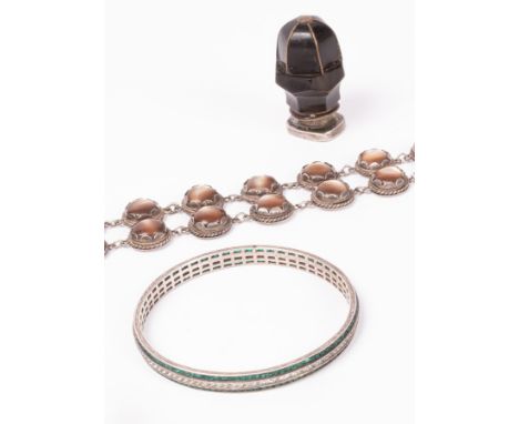 A 19th Century horn and quartz seal, silver and chatoyant gem set bracelet, silver and green enamel compact and a silver colo