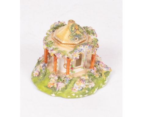A Coalbrookdale porcelain flower-encrusted pastille burner in the form of an octagonal pavilion, marked CD, 10.5cm high   CON