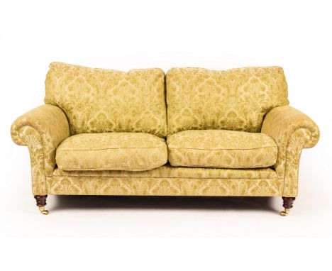 A two-seater sofa by George Smith Ltd., fitted loose seat and back cushions, upholstered in Gainsborough silk, on turned legs