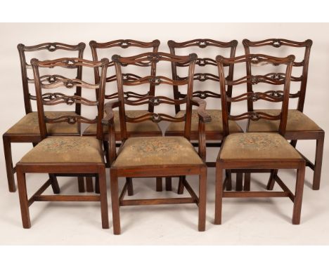 Six pierced and carved mahogany ladder back dining chairs, on square chamfered legs and a matching armchair CONDITION REPORT: