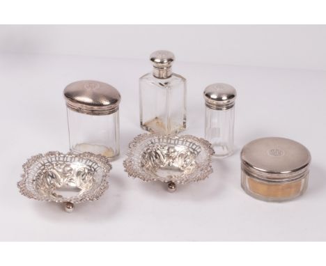 Four silver mounted bottles/jars, CD, London 1923, each initialled KPS, with engine turned decoration and a pair of silver bo